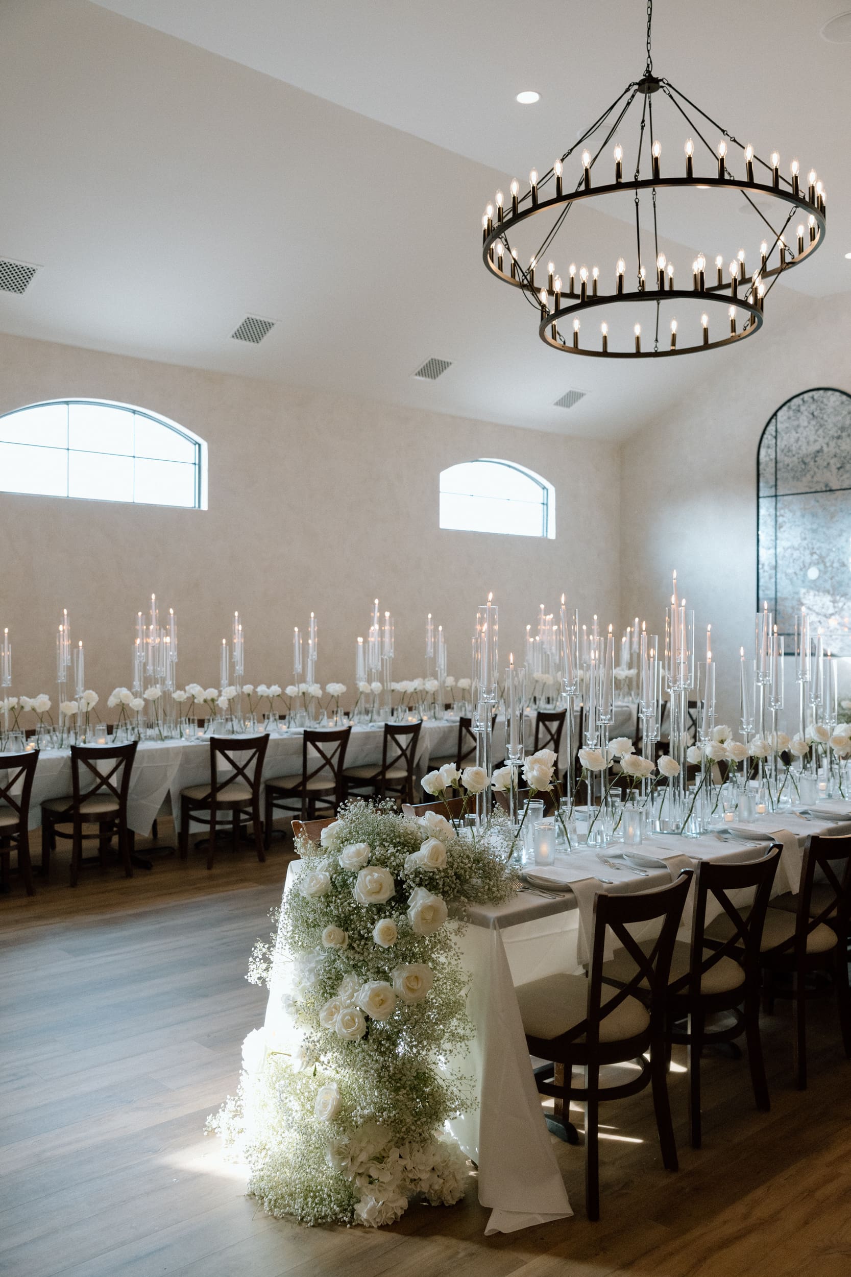 custom baby breath waterfalls on tables at intimate wedding dinner